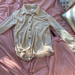 This is 6button up beige striped woman small fashion shirt.